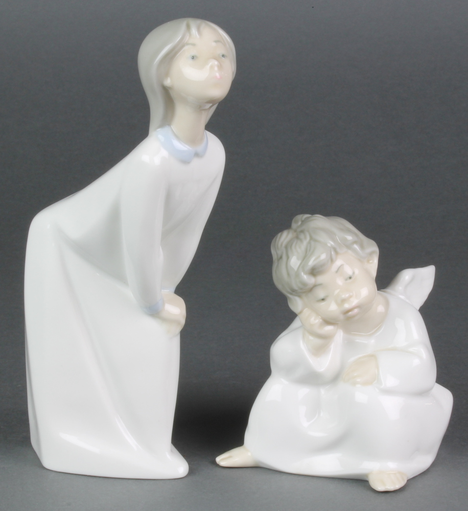 A Lladro figure of a seated angel A/100 4" and a Lladro figure of a girl in nightdress 0/20E 8"