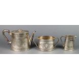 An Edwardian silver plated 3 piece tea set with chased floral decoration, a silver plated swing
