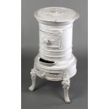 A Rosieres French cylindrical cast iron solid fuel stove, raised on cabriole supports 28 1/2"h x 15"