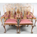 A set of 8 Edwardian Chippendale style slat back dining chairs with upholstered drop in seats,