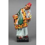 A Royal Doulton figure - Carpet Seller HN1464 9"