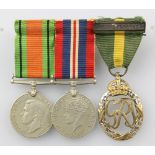 A World War II trio comprising Defence, British War and Territorial Decoration medal
