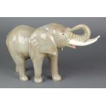 A Sylvac figure of a standing bull elephant 15 1/2" 1 tusk is stuck twice