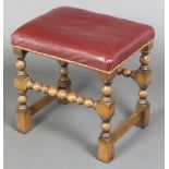 A 17th Century style rectangular oak stool raised on bobbin turned and block supports, the seat