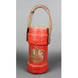 A cordite carrier with leather handle and decorated Royal Arms 12"