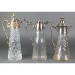 A silver plated cut glass ewer and 2 others