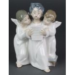 A Lladro group of 3 singing angels 7"