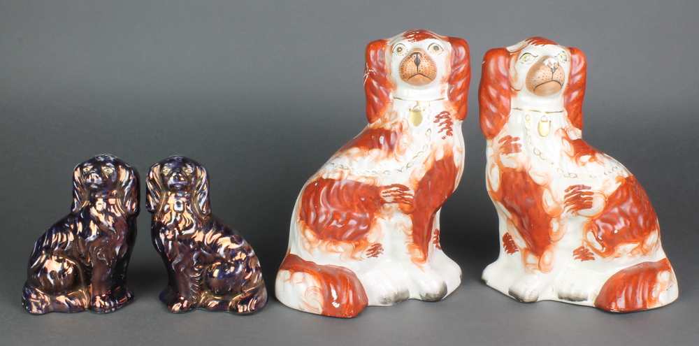 A pair of Victorian Staffordshire ochre spaniels with gilt decoration 9" and a smaller later