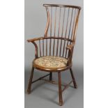 An Edwardian stick and rail back carver chair with upholstered seat on turned supports and H