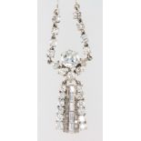 A white gold and drop diamond pendant, the centre brilliant stone approx. 1.7ct surrounded by