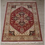 A contemporary Belgian cotton red and white ground Ziegler style rug 88" x 64"