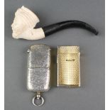 An Edwardian chased silver vesta/sovereign case 2 1/2", Birmingham 1905 together with a Meerschaum