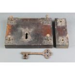 Hart & Sons of Wych Street London, a 19th Century iron door lock contained in an oak iron bound