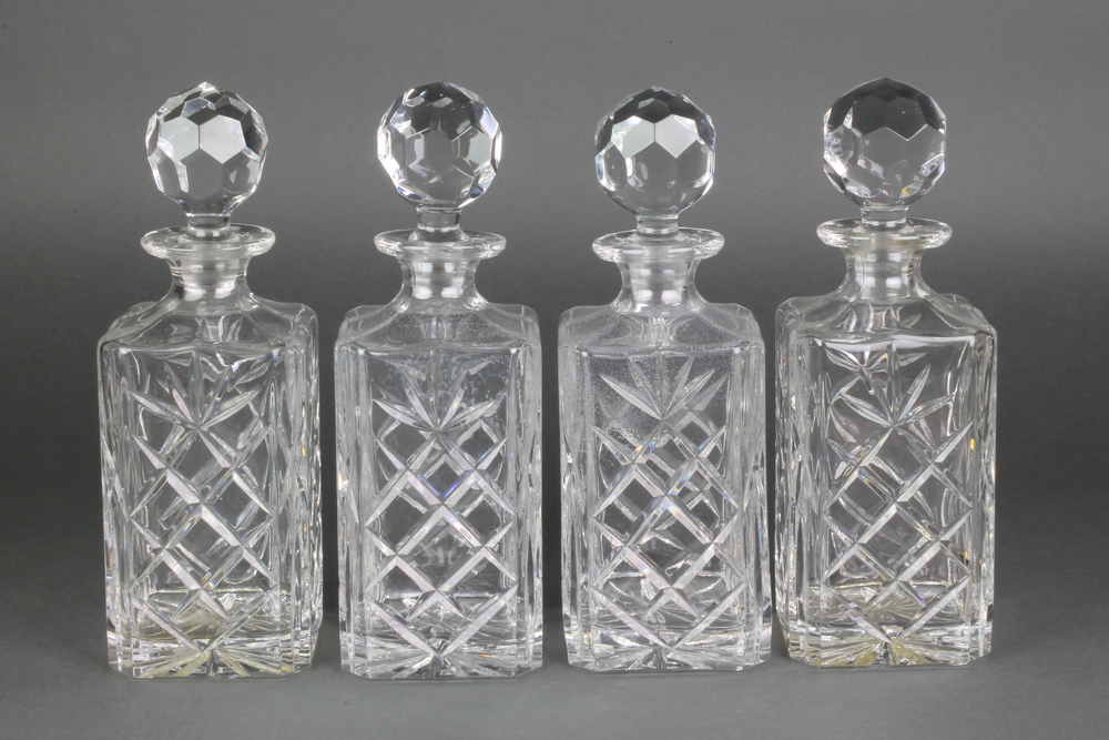 A set of 4 square spirit decanters and stoppers 10 1/2"