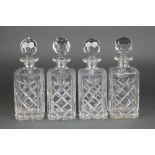 A set of 4 square spirit decanters and stoppers 10 1/2"