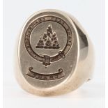 A gentleman's 9ct gold die cut signet ring with crest, size R 1/2, 25 grams
