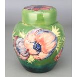 A Moorcroft green ground ginger jar and cover decorated with Anemone 6", impressed and painted marks