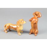 A Beswick figure of a seated Dachshund 4", a Continental ditto 4"
