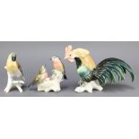 Karl Ens, a German porcelain figure of a cockerel 11" , 1 other of 2 birds by a nest 6" and 1 of a