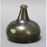 A 17th/18th Century dark green glass onion shaped wine bottle 6" There are 2 slight chips to the rim