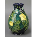 A Moorcroft baluster vase, the blue ground with spring flowers, impressed marks 7 1/2"