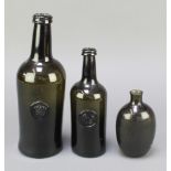 An 18th/19th Century green glass club shaped wine bottle with coronet seal marked P, 1 other club