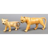 A Beswick figure of a walking lion cub 7" and 1 other of a lioness 9"The first item has