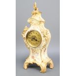 A Victorian French 8 day striking mantel clock with gilt dial and Arabic numerals contained in a