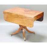 A 19th Century mahogany pedestal Pembroke table fitted a drawer, raised on a turned column and
