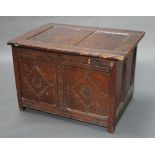 An 18th Century oak coffer of panelled construction with hinged lid 22"h x 33"w x 23 1/2"d There
