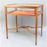 An Edwardian crossbanded and inlaid rectangular bijouterie table, raised on square tapered legs 29"h