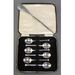 A cased set of 6 silver coffee spoons Sheffield 1937 62 grams and a silver handled button hook