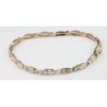 A 10ct yellow gold baguette brilliant cut diamond set bracelet, 2.0ct 180mm