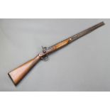 An 18th/19th Century muzzle loading percussion rifle with 26 1/2" barrel and ram rod The barrel is