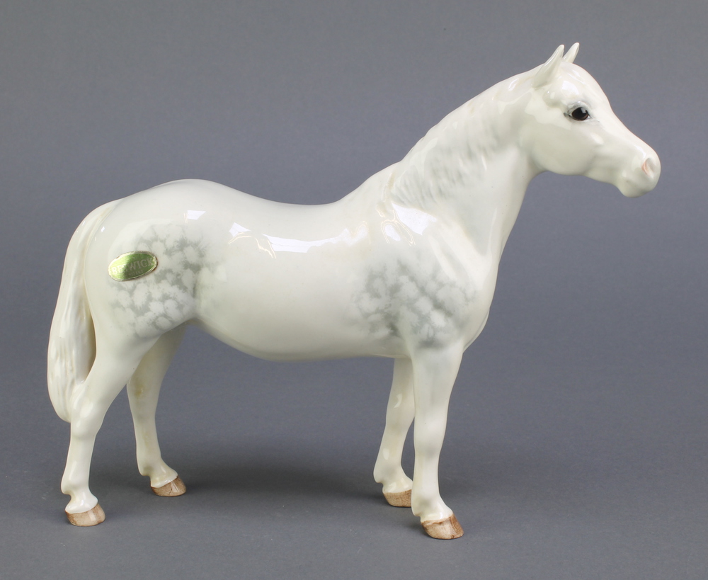 A Beswick figure of a white dappled horse - Connemara 9"