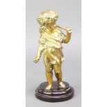 A bronzed figure of a standing cherub 7"h raised on a socle base together with a circular Newlyn