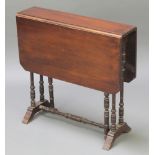 A Victorian mahogany Sutherland table raised on turned supports 23 1/2"h x 24"l x 6"w when closed