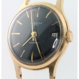 A gentleman's vintage gilt cased Ingersoll calendar wristwatch with red tipped second hand, black
