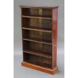 A Victorian mahogany bookcase fitted adjustable shelves, raised on a platform base 48"h x 28"w x 7