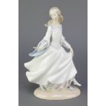 A Lladro figure of a lady with slipper, 10", boxedThere are some minor chips to the flowers, this