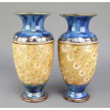 A pair of Royal Doulton oviform vases, the blue ground with wide band of flowers 7205, 11"