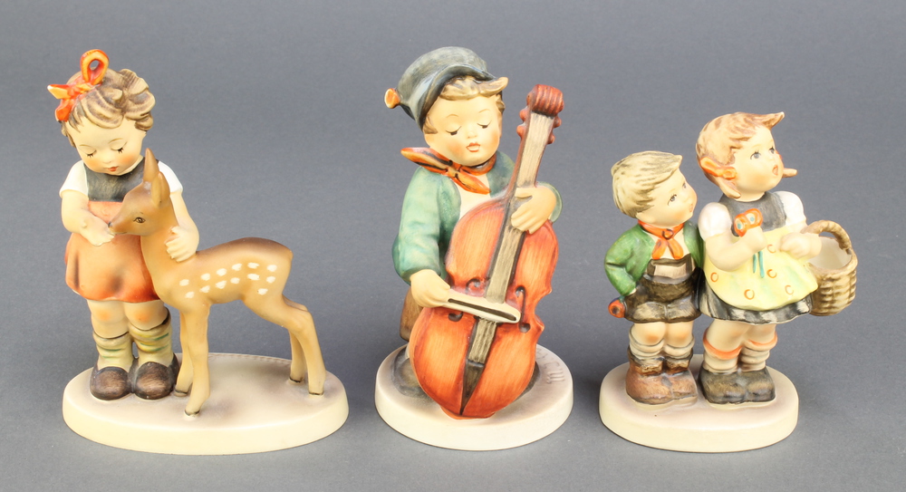 3 Hummel figures - boy cello player 186 5", girl and boy with basket 493/0 4 1/2" and friends 1947