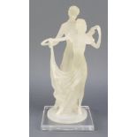 A perspex figure group of 2 standing dancers, raised on a square base, 13 1/2"