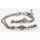 A lady's Edwardian silver watch chain with tassels