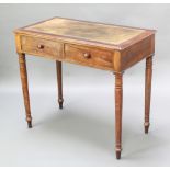 A Victorian mahogany writing table fitted 2 drawers and 2 dummy drawers with green inset leather