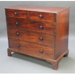 A 19th Century mahogany chest of 2 short and 3 long drawers with tore handles and brass escutcheons,