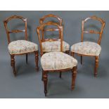 A set of 4 Victorian inlaid mahogany rail back dining chairs with shaped mid rails and upholstered