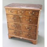 A "Queen Anne" style walnut book press chest with canted corners, fitted 3 short drawers above 3