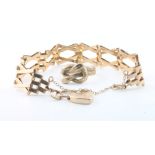 A 9ct yellow gold gate bracelet and padlock together with 9ct yellow gold snake ring size L 1/2,