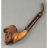 A 19th Century carved wooden pipe, the bowl in the form of a bearded gentleman (possibly a